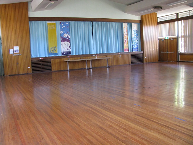 Pearce Community Centre main hall - view across a wooden floor towards the stage